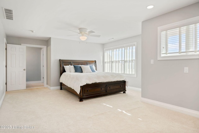 bedroom with visible vents, carpet flooring, and baseboards