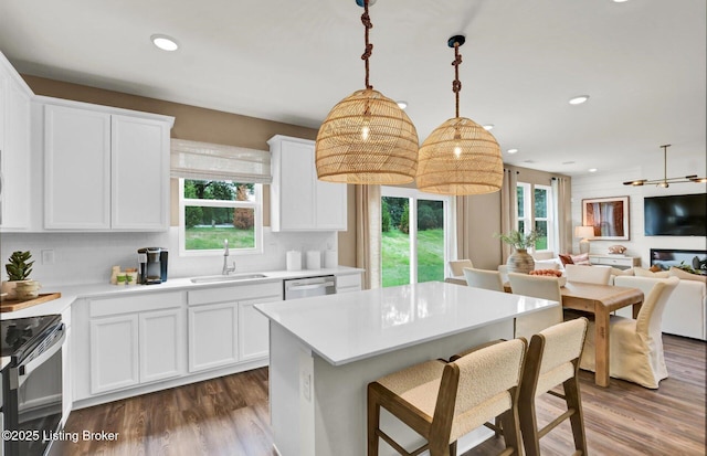 8308 Fairmount Rd, Louisville, KY 40291 - kitchen featuring a wealth of natural light, black range with electric stovetop, dishwasher, and a sink