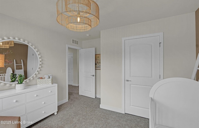 8308 Fairmount Rd, Louisville, KY 40291 - bedroom featuring baseboards, light colored carpet, a notable chandelier, and visible vents