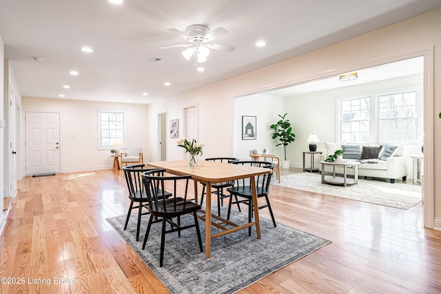dining space with light wood-style flooring, a ceiling fan, and recessed lighting
