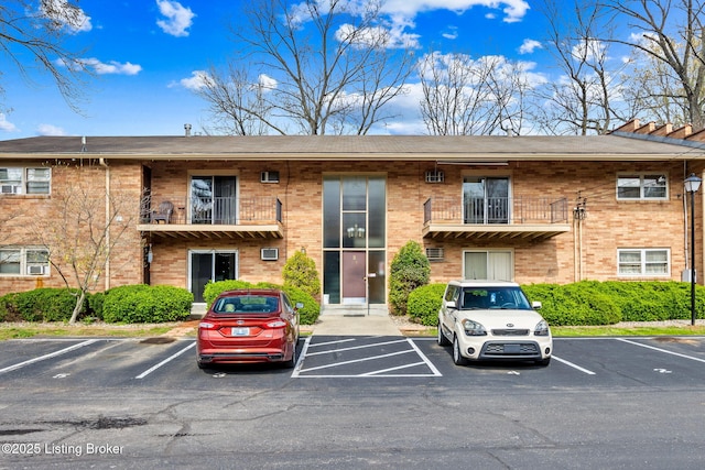 view of property with uncovered parking