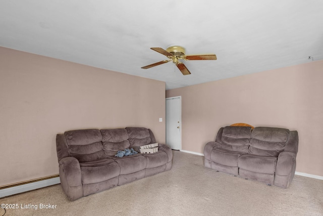 living room with carpet floors, a baseboard radiator, baseboards, and ceiling fan