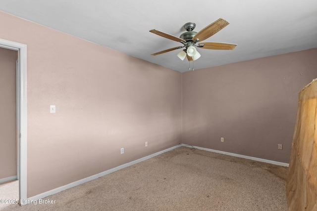 empty room featuring baseboards, a ceiling fan, and carpet floors