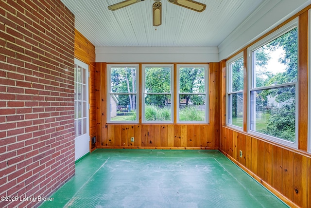 325 Wood Rd, Lyndon, KY 40222 - unfurnished sunroom featuring brick wall, wooden walls, and baseboards