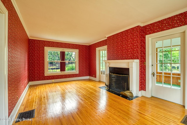 325 Wood Rd, Lyndon, KY 40222 - unfurnished living room featuring a fireplace with flush hearth, wood finished floors, wallpapered walls, and visible vents