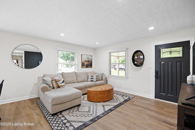 6507 S Dr, Louisville, KY 40272 - living room with baseboards, plenty of natural light, light wood-style floors, a textured ceiling, and recessed lighting