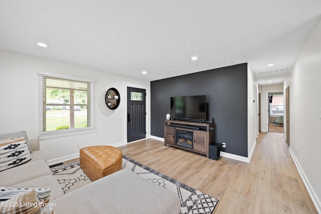6507 S Dr, Louisville, KY 40272 - living room with light wood-type flooring, recessed lighting, baseboards, and a textured ceiling