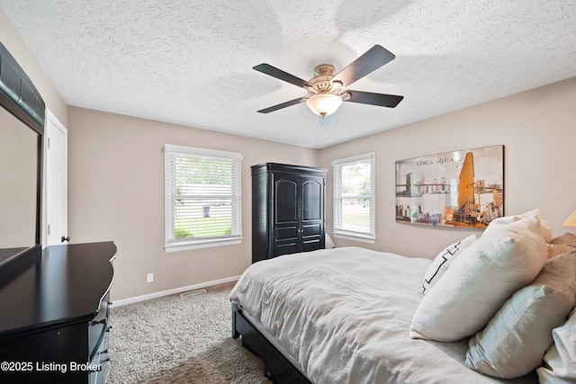6507 S Dr, Louisville, KY 40272 - bedroom featuring baseboards, a ceiling fan, a textured ceiling, and carpet floors