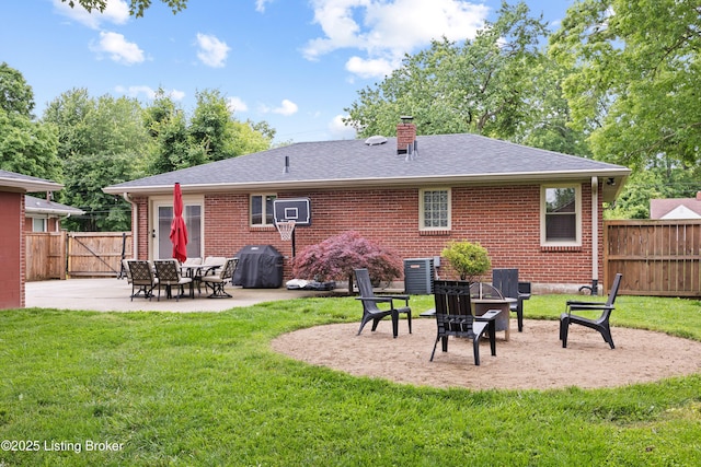 6507 S Dr, Louisville, KY 40272 - back of house with brick siding, a patio area, a chimney, and roof with shingles