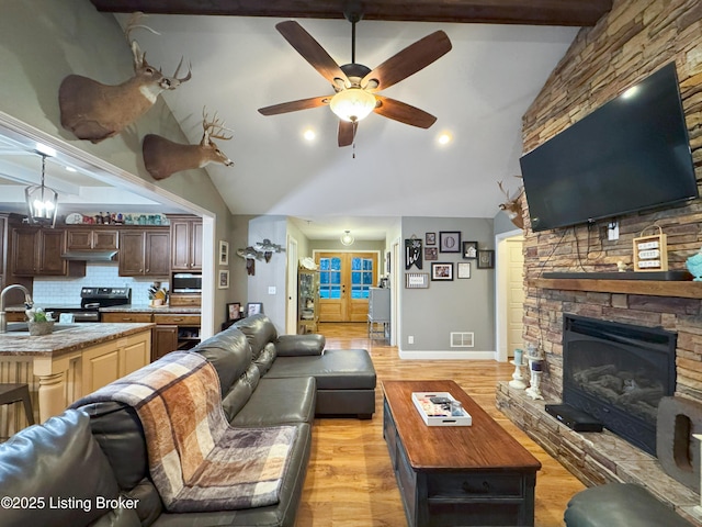 444 Wire Ln, Bardstown, KY 40004 - living room with visible vents, baseboards, light wood-style floors, ceiling fan, and a stone fireplace