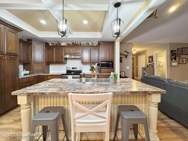 444 Wire Ln, Bardstown, KY 40004 - kitchen with under cabinet range hood, light wood-style flooring, decorative backsplash, and stainless steel appliances