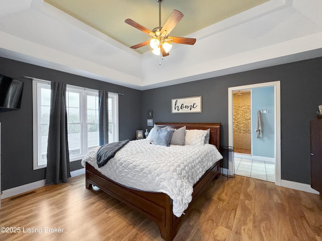 444 Wire Ln, Bardstown, KY 40004 - bedroom with baseboards, visible vents, light wood-style floors, a ceiling fan, and a raised ceiling