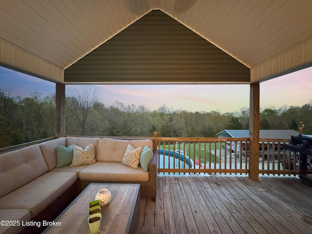 444 Wire Ln, Bardstown, KY 40004 - deck at dusk with a pool, a view of trees, and an outdoor living space