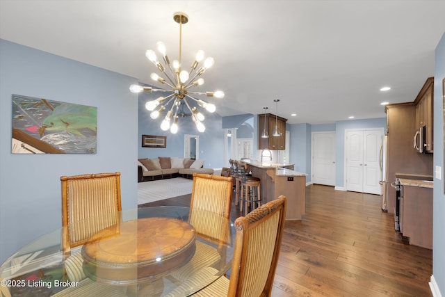 178 Bluffs Edge Dr, Mt Washington, KY 40047 - dining room with recessed lighting, baseboards, an inviting chandelier, and dark wood finished floors