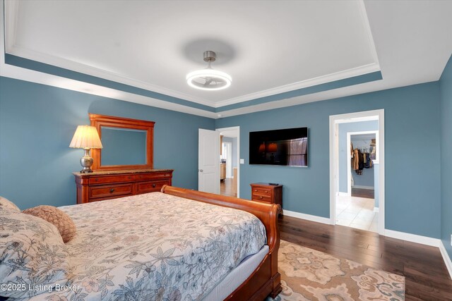 178 Bluffs Edge Dr, Mt Washington, KY 40047 - bedroom featuring a raised ceiling, wood finished floors, baseboards, and ornamental molding