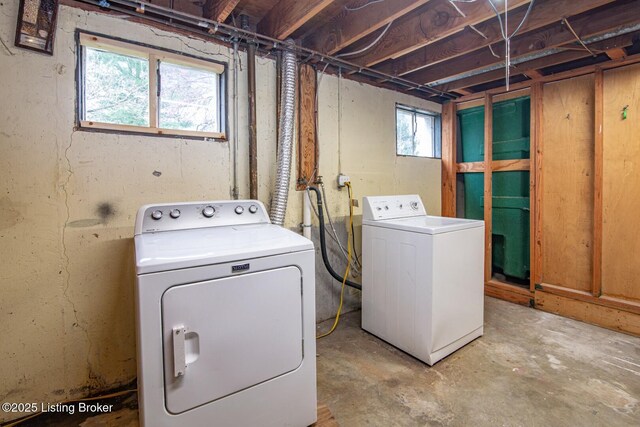 laundry area with washer and clothes dryer and laundry area