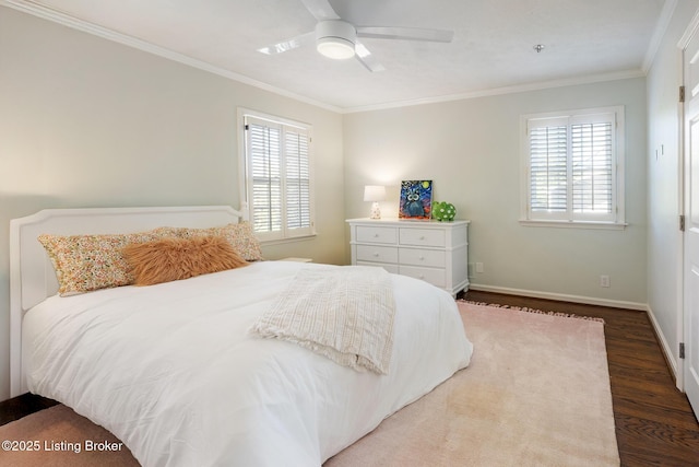 bedroom with wood finished floors, ceiling fan, baseboards, and ornamental molding