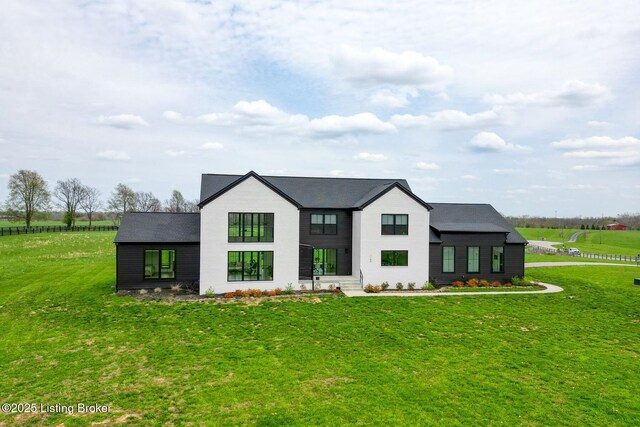 modern inspired farmhouse featuring a front yard