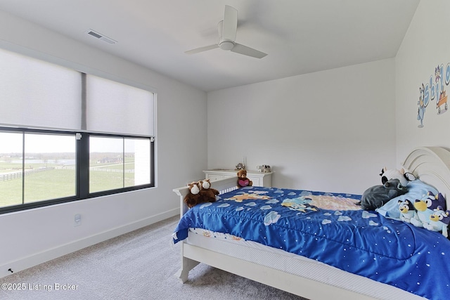 bedroom featuring baseboards, visible vents, carpet floors, and ceiling fan