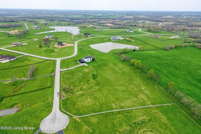 aerial view featuring a rural view and a water view