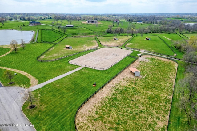 birds eye view of property with a rural view and a water view