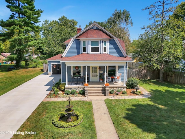 205 Birch Ave, La Grange, KY 40031 - victorian-style house with a porch, a front yard, a gambrel roof, and fence