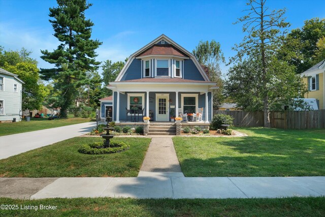 205 Birch Ave, La Grange, KY 40031 - victorian home with a porch, a front yard, a gambrel roof, and fence