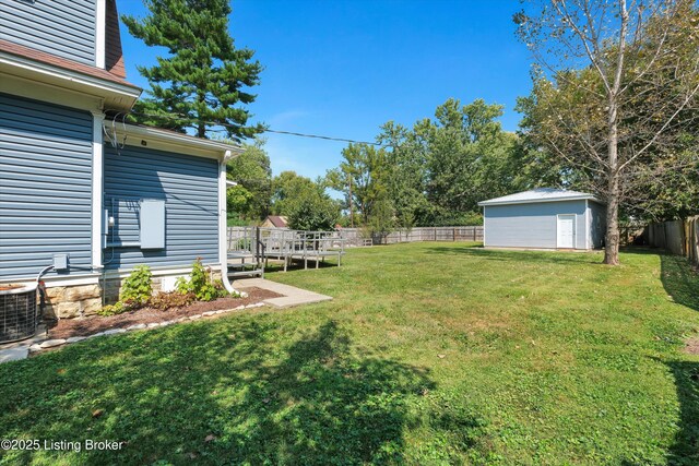 205 Birch Ave, La Grange, KY 40031 - view of yard featuring cooling unit, a wooden deck, an outbuilding, a storage shed, and a fenced backyard
