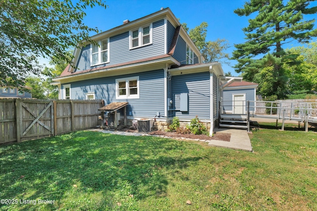 205 Birch Ave, La Grange, KY 40031 - rear view of house with a lawn, a gate, central AC unit, and a fenced backyard