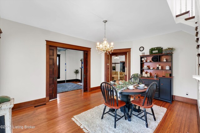 205 Birch Ave, La Grange, KY 40031 - dining space featuring baseboards, an inviting chandelier, and light wood-style floors