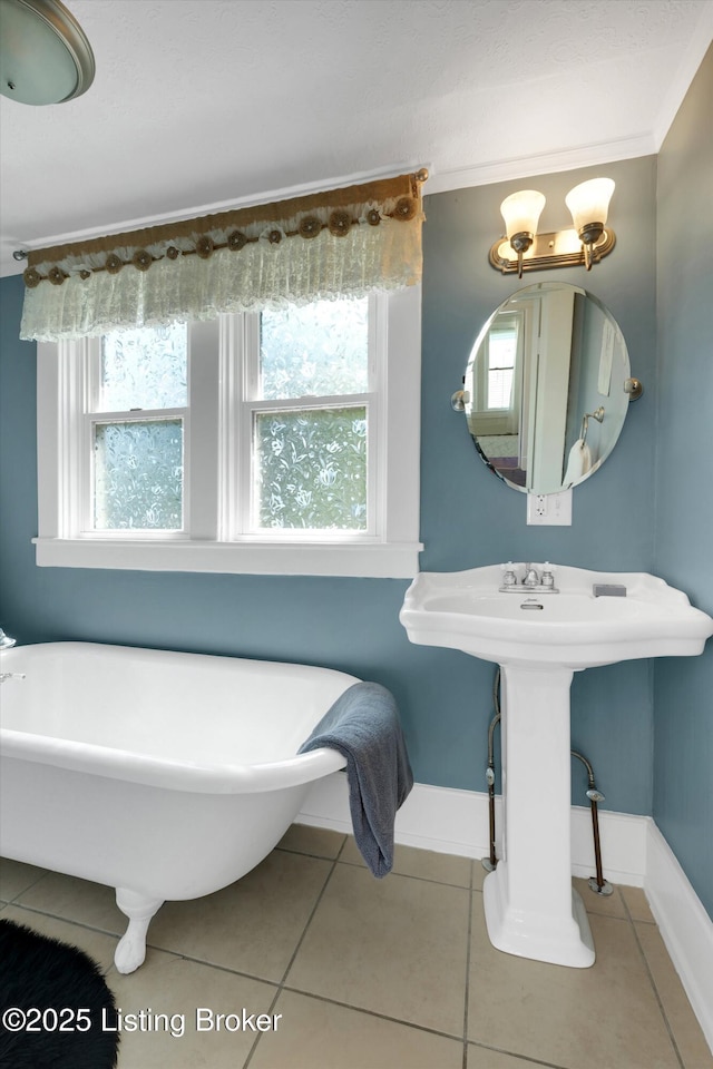 205 Birch Ave, La Grange, KY 40031 - full bath featuring baseboards, a freestanding tub, tile patterned flooring, and crown molding