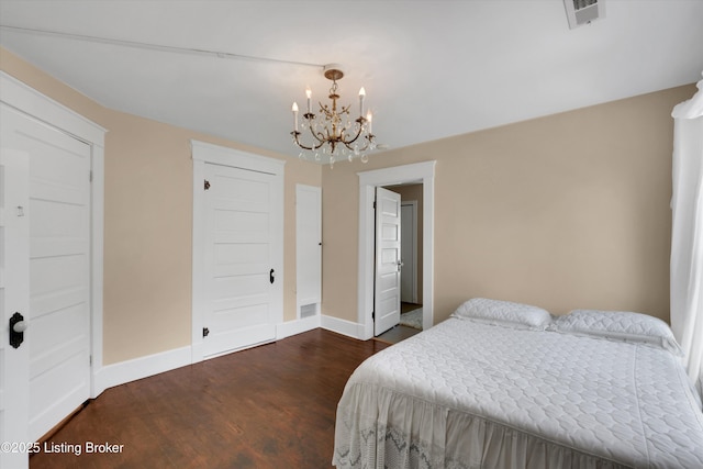205 Birch Ave, La Grange, KY 40031 - bedroom with dark wood-style floors, visible vents, a notable chandelier, and baseboards