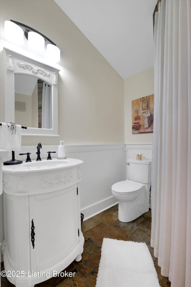 205 Birch Ave, La Grange, KY 40031 - bathroom featuring toilet, wainscoting, stone finish floor, and vanity