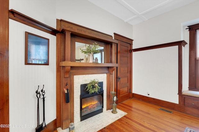 205 Birch Ave, La Grange, KY 40031 - unfurnished living room with a fireplace, wood finished floors, visible vents, and baseboards
