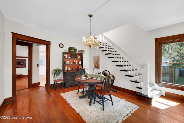 205 Birch Ave, La Grange, KY 40031 - dining space featuring stairway, wood finished floors, a notable chandelier, and baseboards