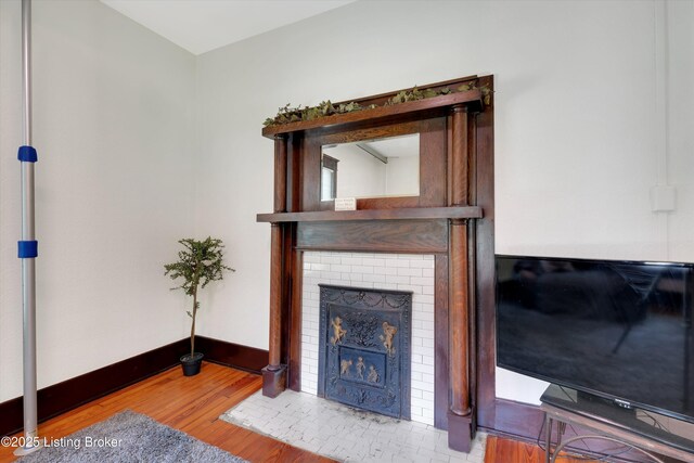 205 Birch Ave, La Grange, KY 40031 - living room featuring baseboards, wood finished floors, and a fireplace