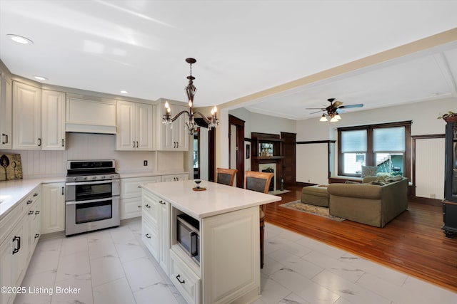 205 Birch Ave, La Grange, KY 40031 - kitchen featuring recessed lighting, marble finish floor, stainless steel appliances, and light countertops