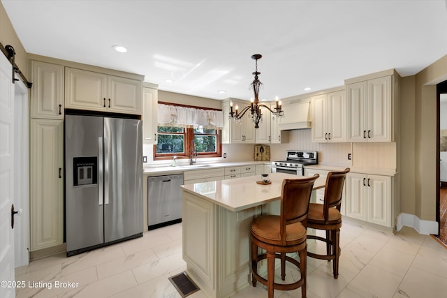 205 Birch Ave, La Grange, KY 40031 - kitchen featuring an inviting chandelier, a sink, custom exhaust hood, light countertops, and appliances with stainless steel finishes