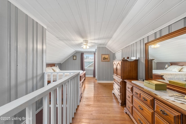 interior space with lofted ceiling, light wood finished floors, and ceiling fan