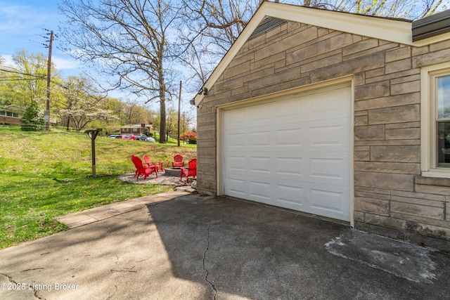 detached garage featuring driveway