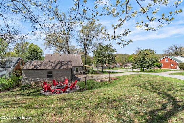 view of yard with a fire pit