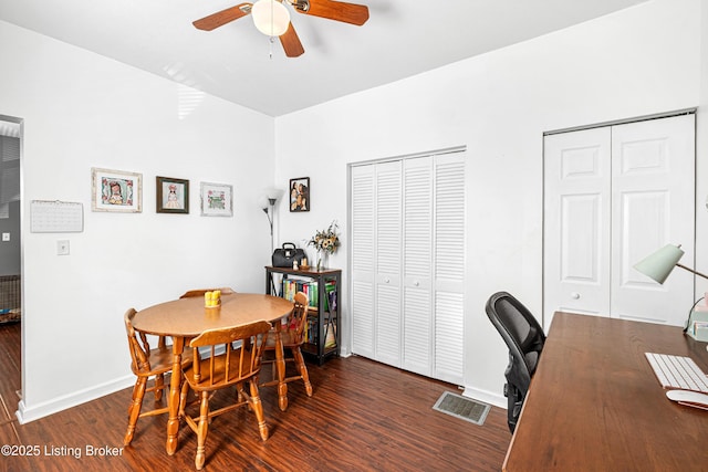 dining area featuring baseboards, a ceiling fan, wood finished floors, and visible vents