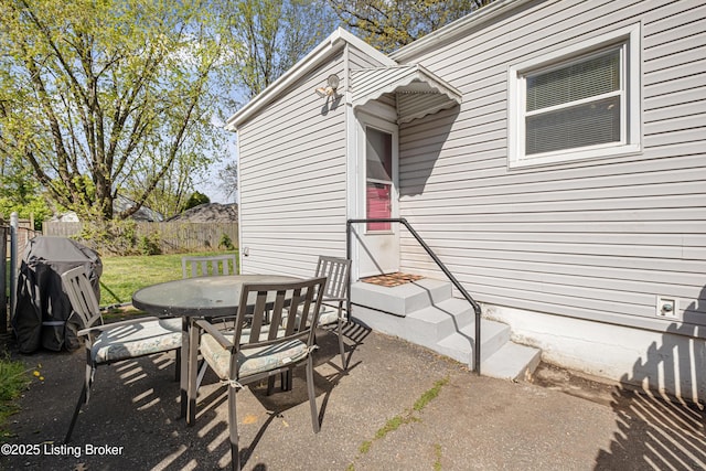 view of patio / terrace featuring outdoor dining area and fence
