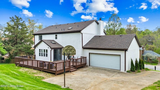 back of house featuring a wooden deck, concrete driveway, a chimney, and a garage