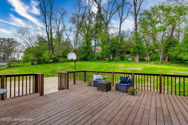 wooden terrace featuring a lawn and an outdoor living space