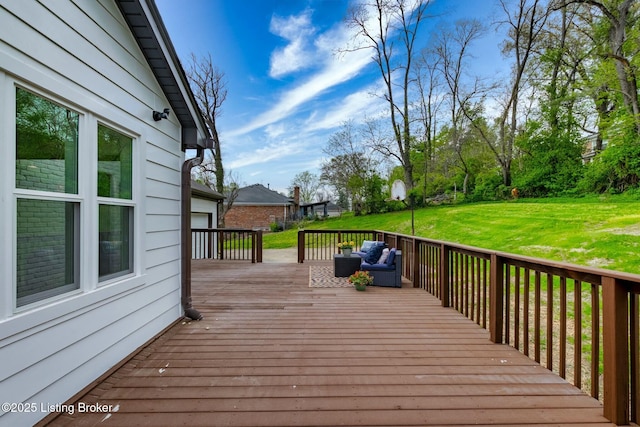 wooden deck featuring a lawn and outdoor lounge area