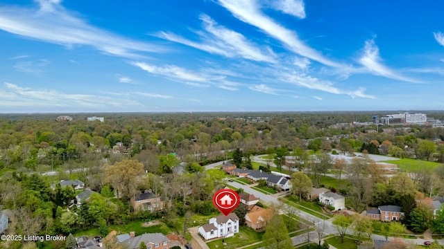 drone / aerial view with a forest view and a residential view