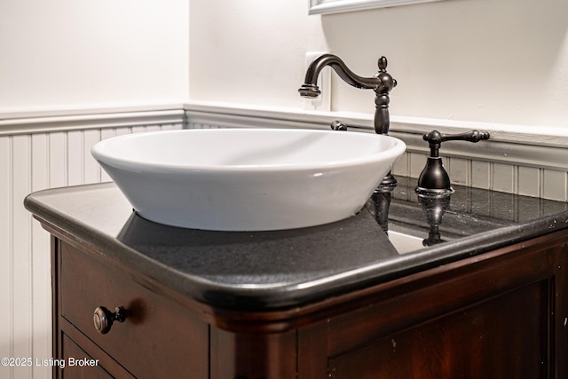 details featuring wainscoting and a sink