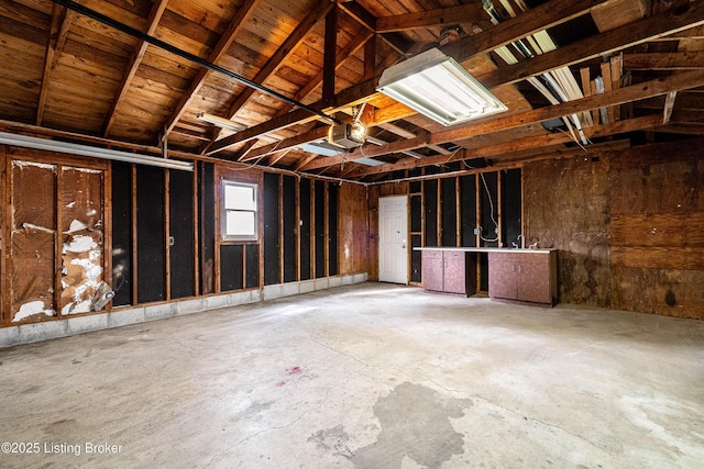 miscellaneous room featuring a garage and concrete flooring