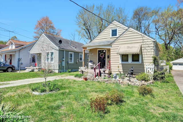 bungalow-style home with a front lawn